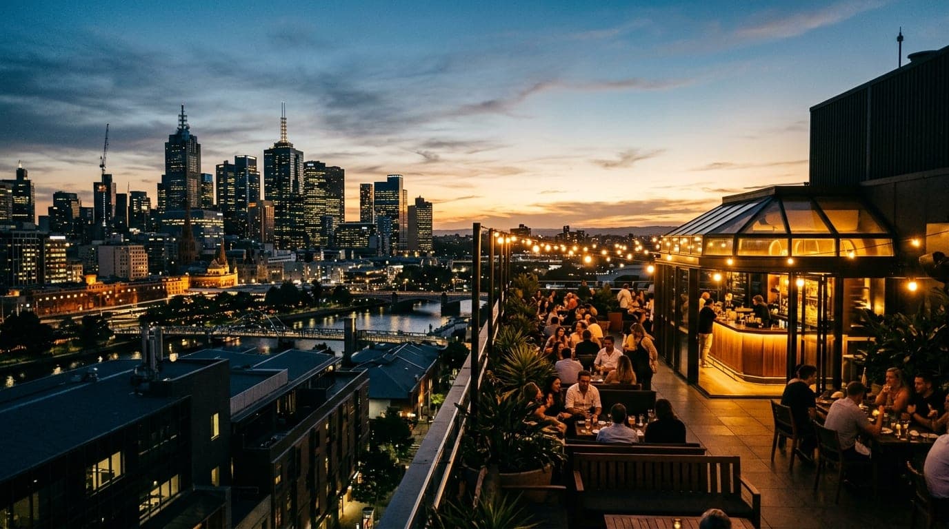 A wide-angle 35mm shot captures the vibrant neon signage of a Bridge Street rooftop bar at dusk. The glowing city skyline...