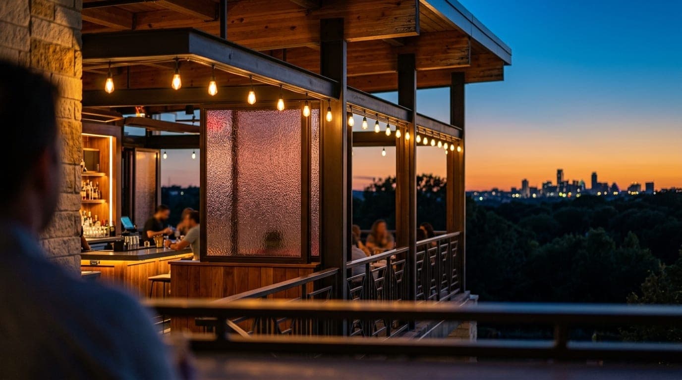 A 100mm macro shot focusing on the mid-century modern architectural details of The Ruby Hotel terrace, capturing glowing b...